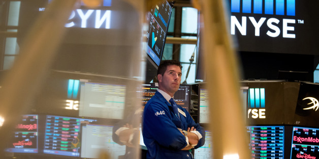 A trader works on the floor of the New York Stock Exchange (NYSE) in New York, U.S., on Monday, Aug. 22, 2016. U.S. stocks fluctuated after erasing an early slide, as a rally in drugmakers spurred by deal activity offset declines in commodity shares led by falling crude-oil prices. Photographer: Michael Nagle/Bloomberg via Getty Images