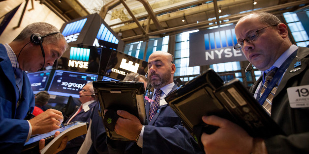 Traders work on the floor of the New York Stock Exchange (NYSE) in New York, U.S., on Monday, Nov. 21, 2016. U.S. stocks were set for the highest closing level on record, led by energy companies, as oil jumped on optimism OPEC will agree to cut output. Photographer: Michael Nagle/Bloomberg via Getty Images