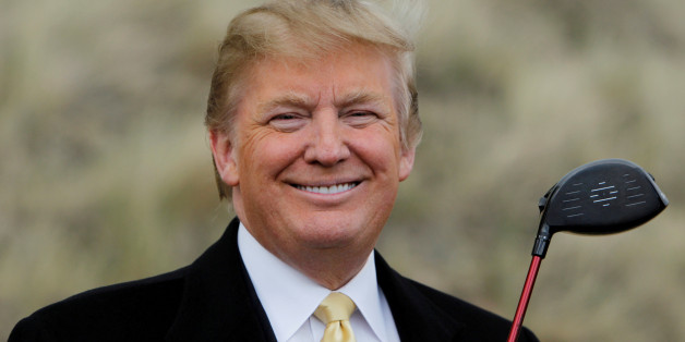 U.S. property mogul Donald Trump holds a golf club during a media event on the sand dunes of the Menie estate, the site for Trump's proposed golf resort, near Aberdeen, Scotland, Britain May 27, 2010. REUTERS/David Moir/File Photo FROM THE FILES PACKAGE "THE CANDIDATES" - SEARCH CANDIDATES FILES FOR ALL 90 IMAGES