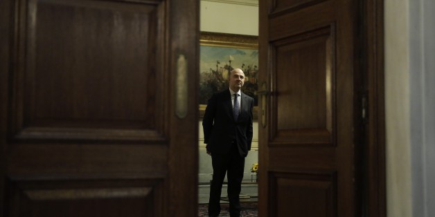 European Commissioner for Economic and Financial Affairs Pierre Moscovici stands before a meeting with the Greek Prime Minister in Athens, on Tuesday, Nov. 3, 2015. Moscovici's talks with officials in Greece's leftwing government will focus on the progress of reforms demanded by the country's European creditors in return for a third multi-billion euro bailout. (AP Photo/Petros Giannakouris)