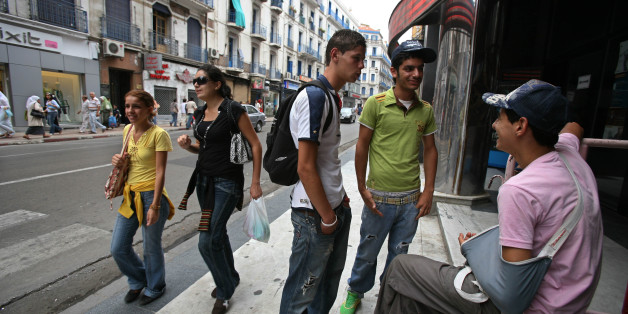 Algerian people chat at Didouche Mourad Street in Algiers in this July 1, 2007 picture. Despite increased wealth and improved security, Algiers' faded grandeur is virtually unknown overseas thanks to powerful deterrents -- a history of political violence, a post-war mood of despondency and lingering official indifference to tourism. To match feature ALGERIA-CITY/ REUTERS/Zohra Bensemra (ALGERIA)