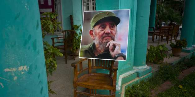 An image of the late Fidel Castro stands on a chair in a government building in Havana, Cuba, Sunday, Nov. 27, 2016, two days after his death. Cuba is observing nine days of mourning for the former president who ruled Cuba for half a century. (AP Photo/Ramon Espinosa)