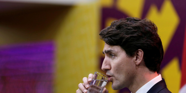 Canada's Prime Minister Justin Trudeau drinks water as he holds a press conference at the conclusion of the APEC (Asia-Pacific Economic Cooperation) Summit in Lima, Peru November 20, 2016. REUTERS/Guadalupe Pardo