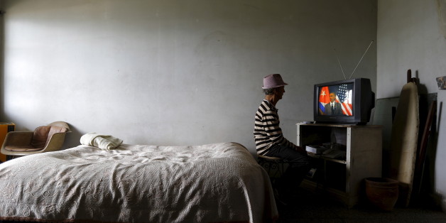 A man watches on television as U.S. President Barack Obama delivers a speech at the Gran Teatro de la Habana Alicia Alonso in Havana, March 22, 2016. REUTERS/Ivan Alvarado TPX IMAGES OF THE DAY