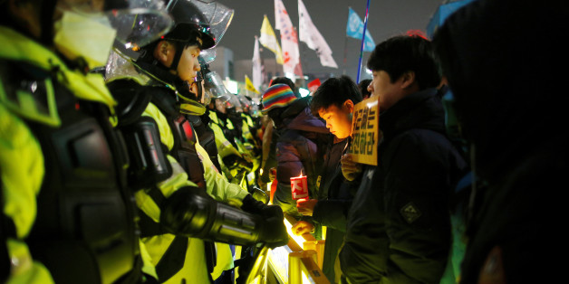 People attend a protest calling for Park Geun-hye to step down on a road leading to the Presidential Blue House in Central Seoul, South Korea, November 26, 2016. REUTERS/Kim Hong-Ji
