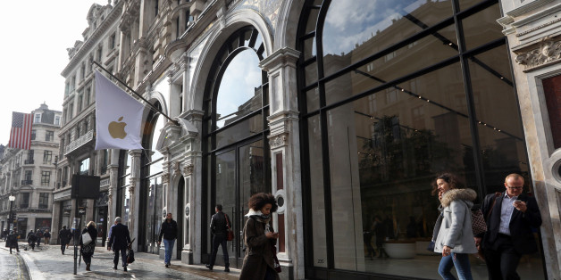 Pedestrians pass the newly refurbished Apple Inc. store on Regent Street in London, U.K., on Thursday, Oct. 13, 2016. The store will open to the public on Saturday, Oct. 15. Photographer: Chris Ratcliffe/Bloomberg via Getty Images