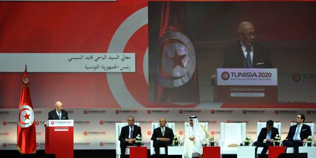 Tunisian President Beji Caid Essebsi (L) gives a speech during the opening ceremony of the 'Tunisia 2020' international investment conference on November 29, 2016 in Tunis.
France and Qatar promised billions of dollars of financial support to Tunisia at the launch Tuesday of a conference aimed at reviving the country's struggling economy. Nearly six years after its Arab Spring revolution, Tunisia is hosting the conference in a bid to face down daunting economic challenges. / AFP / FETHI BELAID (Photo credit should read FETHI BELAID/AFP/Getty Images)