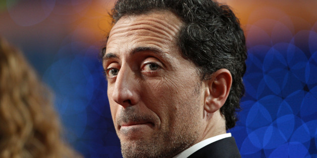 French actor Gad Elmaleh attends the 25th Telethon organised by the French Muscular Dystrophy Association (AFM) in Saint Denis, near Paris December 3, 2011. The annual fundraising event, which is aired live on French television for 30 hours, is held to collect money for research into genetic diseases in children. REUTERS/Gonzalo Fuentes (FRANCE - Tags: ENTERTAINMENT MEDIA SOCIETY HEADSHOT)