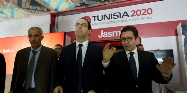 Tunisian Prime Minister Youssef Chahed (C) and Tunisia's Investment and International Cooperation Minister Fadhel Abdelkefi (R) arrive to inspect the final preparation at the Congress Palace in the capital Tunis, on November 27, 2016, two days ahead of the opening ceremony of the 'Tunisia 2020' conference.
Tunisia will host 2,000 business and finance executives from 40 countries this week in hopes of drumming up investment to boost its struggling economy. / AFP / FETHI BELAID (Photo credit should read FETHI BELAID/AFP/Getty Images)