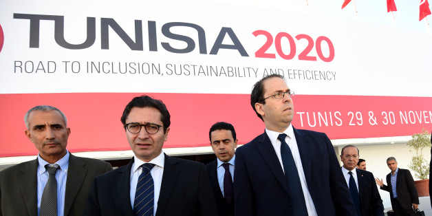 Tunisian Prime Minister Youssef Chahed (R) and Tunisia's Investment and International Cooperation Minister Fadhel Abdelkefi (C) arrive to inspect the final preparation at the Congress Palace in the capital Tunis, on November 27, 2016, two days ahead of the opening ceremony of the 'Tunisia 2020' conference.
Tunisia will host 2,000 business and finance executives from 40 countries this week in hopes of drumming up investment to boost its struggling economy. / AFP / FETHI BELAID (Photo credit should read FETHI BELAID/AFP/Getty Images)