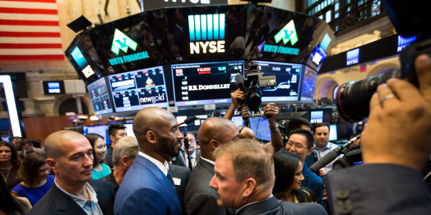 Kobe Bryant, former National Basketball Association (NBA) player, center, tours the floor of the New York Stock Exchange (NYSE) after unveiling his venture-capital fund Bryant Stibel in New York, U.S., on Monday, Aug. 22, 2016. U.S. stocks fluctuated after erasing an early slide, as a rally in drugmakers spurred by deal activity offset declines in commodity shares led by falling crude-oil prices. Photographer: Michael Nagle/Bloomberg via Getty Images