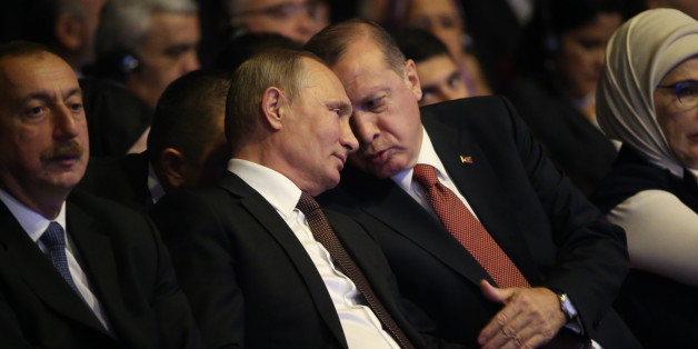 ISTANBUL, TURKEY- OCTOBER 10: (RUSSIA OUT) Russian President Vladimir Putin (C) listens to Turkish President Recep Tayip Erdogan (R) as Azeri President Ilkham Aliyev (L) looks on during the 23rg World Energy Congress on October 10, 2016 in Istanbul,Turkey. Putin is on a day-long visit to Turkey. (Photo by Mikhail Svetlov/Getty Images)