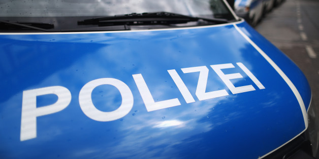 MUNICH, GERMANY - MAY 15: A fleet of police or Polizei vans are pictured parked near the fans of Bayern Muenchen as they celebrate winning the German Championship title on the town hall square at Marienplatz on May 15, 2016 in Munich, Germany. (Photo by Dean Mouhtaropoulos/Bongarts/Getty Images)