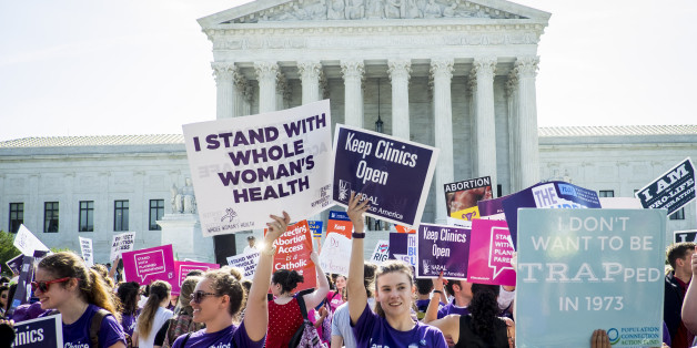 WASHINGTON, DC - JUNE 27: Pro-choice and pro-life activists demonstrate on the steps of the United States Supreme Court on June 27, 2016 in Washington, DC. In a 5-3 decision, the U.S. Supreme Court struck down one of the nation's toughest restrictions on abortion, a Texas law that women's groups said would have forced more than three-quarters of the state's clinics to close. (Photo by Pete Marovich/Getty Images)