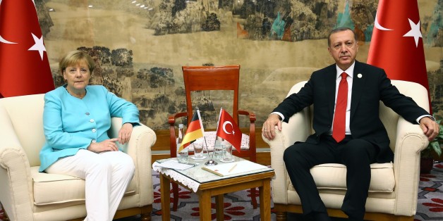 HANGZHOU, CHINA - SEPTEMBER 04: Turkish President Recep Tayyip Erdogan (R) receives German Chancellor Angela Merkel (L) as the 11th G20 Leaders' Summit continues in Hangzhou, China, on September 04, 2016. (Photo by Kayhan Ozer/Anadolu Agency/Getty Images)