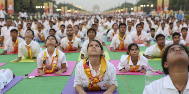 Indians perform yoga at a rehearsal ahead of International Yoga Day at Rajpath, the ceremonial boulevard of the Indian capital in New Delhi, India, Sunday, June 19, 2016. The International Yoga Day will be marked on June 21. (AP Photo)