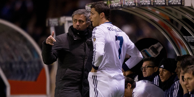 LA CORUNA, SPAIN - FEBRUARY 23: Head coach Jose Mourinho (L) of Real Madrid CF gives instructions to Cristiano Ronaldo (2ndl) on the desk during the La Liga match between RC Deportivo La Coruna and Real Madrid CF at Riazor Stadium on February 23, 2013 in La Coruna, Spain. (Photo by Gonzalo Arroyo Moreno/Getty Images)
