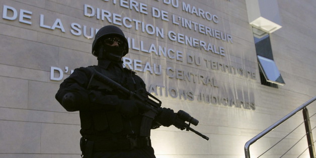 A Moroccan policeman stands guard at the Central Bureau of Judicial Investigation office in Sale, March 23, 2015. Moroccan authorities said on Monday they had dismantled a militant cell planning to create an Islamic State affiliate in the North African kingdom, seizing guns and accusing its members of plotting attacks. Reporters were shown six pistols and ammunition seized from a hideout near the southern city of Agadir, in the offices of the BCIJ in the city of Sale. REUTERS/Stringer