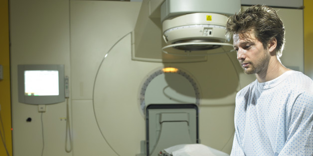 Young male patient sitting in radiology room
