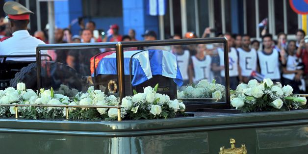 The urn with the ashes of Cuban leader Fidel Castro leaves Revolution Square in Santiago, Cuba on December 4, 2016 on its way to the cemetery.
The ashes of late Cuban leader Fidel Castro were taken on Sunday to be laid to rest at a cemetery in the eastern city of Santiago de Cuba. / AFP / PEDRO PARDO (Photo credit should read PEDRO PARDO/AFP/Getty Images)