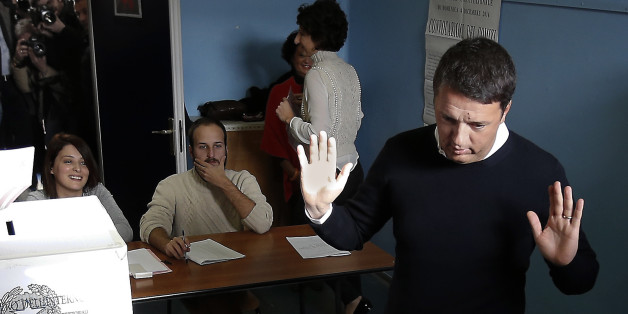 Italian Premier Matteo Renzi gesticulates after casting his ballot at a polling station in Pontassieve, Italy, Sunday, Dec. 4, 2016. Italians voted Sunday in a referendum on constitutional reforms that Premier Matteo Renzi has staked his political future on. Premier Matteo Renzi has said he would resign if the reforms are rejected in Sundayâs vote, and opposition politicians have vowed to press for a new government if voters reject the proposed constitutional changes. (AP Photo/Antonio Calanni)