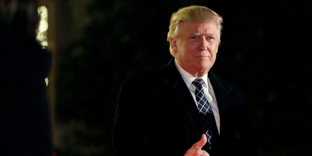U.S. President-elect Donald Trump gives a thumbs up to the media as he arrives at a costume party at the home of hedge fund billionaire and campaign donor Robert Mercer in Head of the Harbor, New York, U.S., December 3, 2016. REUTERS/Mark Kauzlarich