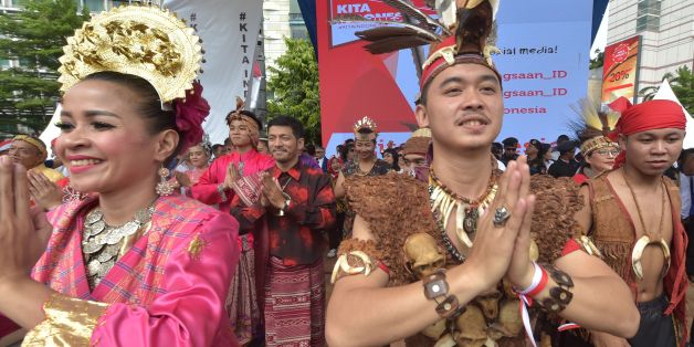 Indonesian dancers perform on a stage during a pro-government rally to call for unity in Jakarta on December 4, 2016. Thousands of people paraded in Indonesia's capital Jakarta on December 4, to call for unity and peace amid growing tensions in the society. / AFP / ADEK BERRY (Photo credit should read ADEK BERRY/AFP/Getty Images)