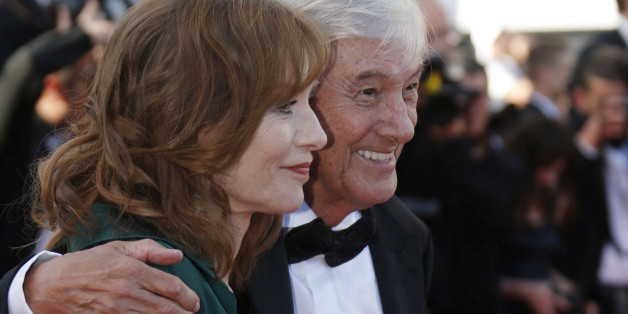 Director Paul Verhoeven (R) and cast member Isabelle Huppert pose on the red carpet as they arrive for the screening of the film "Elle" in competition at the 69th Cannes Film Festival in Cannes, France, May 21, 2016. REUTERS/Regis Duvignau