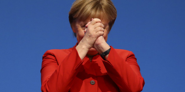 German Chancellor and leader of the conservative Christian Democratic Union party CDU Angela Merkel reacts after her speech at the CDU party convention in Essen, Germany, December 6, 2016. REUTERS/Kai Pfaffenbach