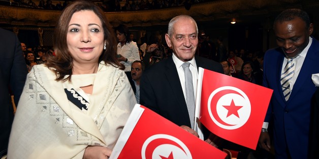 Nobel Peace Prize winners for 2015, Tunisian employers union (UTICA) pesident, Wided Bouchamaoui (L), and Tunisian General Labour Union (UGTT) general secretary, Houcine Abassi (R), arrive for the closing ceremony of the 26th Carthage Film Festival on November 28, 2015 in Tunis. AFP PHOTO / FETHI BELAID / AFP / FETHI BELAID (Photo credit should read FETHI BELAID/AFP/Getty Images)