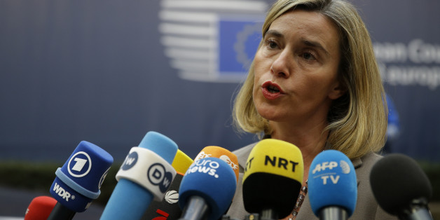 European foreign policy chief Federica Mogherini speaks to media reporters as she arrives for the EU summit in Brussels, Thursday, Oct. 20, 2016. British Prime Minister Theresa May will hold her first talks with European Union leaders and tell them that the U.K.âs decision to leave the bloc is irreversible. (AP Photo/Alastair Grant)