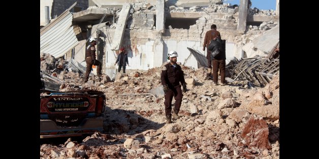 ALEPPO, SYRIA - DECEMBER 6: Civil defense team members carry out search and rescue works after the war crafts belonging to the Syrian Army bombed the bazaar in the Etarib district of Aleppo, Syria on December 6, 2016. (Photo by Ahmed Al Ahmed/Anadolu Agency/Getty Images)