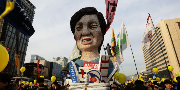 SEOUL, SOUTH KOREA - DECEMBER 03: Protesters gather and occupy major streets in the city center for a rally against South Korean President Park Geun-hye on December 3, 2016 in Seoul, South Korea. Park addressed to the nation this week that she would leave it to the Parliament to decide if she should step down from her presidency after her friend Choi Soon-sil was charged with corrupt influence over state affairs. (Photo by Chung Sung-Jun/Getty Images)