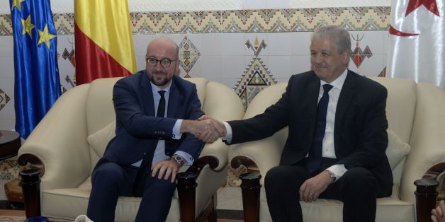 Belgian Prime Minister, Charles Michel (L) meets with Algerian Prime Minister Abdelmalek Sellal upon his arrival at the International Houari Boumediene airport outside the capital Algiers on December 6, 2016. / AFP / RYAD KRAMDI (Photo credit should read RYAD KRAMDI/AFP/Getty Images)
