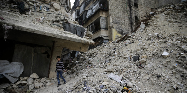 In this Monday, Dec. 5, 2016 photo, a Syrian girl walks amid the wreckage of damaged buildings and shops in the western city of Aleppo, Syria. Aleppo shakes with explosions and gunfire day and night in both the government and rebel sides. But for supporters of President Bashar Assad at least, there is comfort in the growing sense of imminent victory in the city. A rebel defeat in Aleppo, Syriaâs largest city and former commercial center, is likely to reverberate across the war-torn country, where opposition forces continue to hold out in smaller, more disconnected areas. (AP Photo/Hassan Ammar)