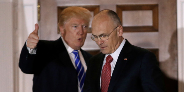 U.S. President-elect Donald Trump gestures as Andy Puzder, CEO of CKE Restaurants, departs after their meeting at the main clubhouse at Trump National Golf Club in Bedminster, New Jersey, U.S., November 19, 2016. REUTERS/Mike Segar