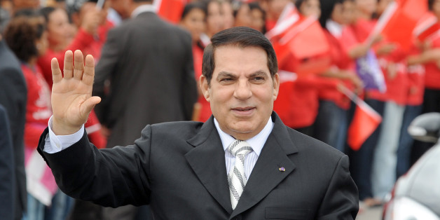 Tunisian President Zine El Abidine Ben Ali (L) waves to wellwishers before delivering his speech at the start of the prtesidential election campaign on October 11, 2009 in Rades stadium near Tunis. Ben Ali, who looks set to be re-elected to a fifth consecutive term in 25 October elections, has brought economic growth to his north African country but has been widely criticised for his harsh stand on human rights. Ben Ali, 73, took power in a bloodless coup in 1987 ousting president-for-life Habib Bourguiba, the country's first head of state after Tunisia's independence from France in 1956, on the grounds that he was senile. AFP PHOTO FETHI BELAID (Photo credit should read FETHI BELAID/AFP/Getty Images)