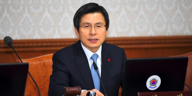 South Korea's Prime Minister and acting President Hwang Kyo-Ahn speaks during a Cabinet meeting at the government complex in Seoul on December 9, 2016 after parliament passed a motion of impeachment.South Korean lawmakers on December 9, voted to impeach President Park Geun-Hye, stripping away her sweeping executive powers over a corruption scandal and opening a new period of national uncertainty. / AFP / JUNG Yeon-Je (Photo credit should read JUNG YEON-JE/AFP/Getty Images)