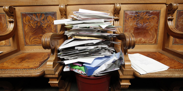 A recycling bin filled with paper is seen in the National Council after the last day of the summer parliament session in Bern June 18, 2010. REUTERS/Pascal Lauener (SWITZERLAND - Tags: POLITICS)