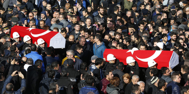People carry the flag-draped coffins of police officers killed in Saturday's blasts in Istanbul, Turkey, December 11, 2016. REUTERS/Murad Sezer