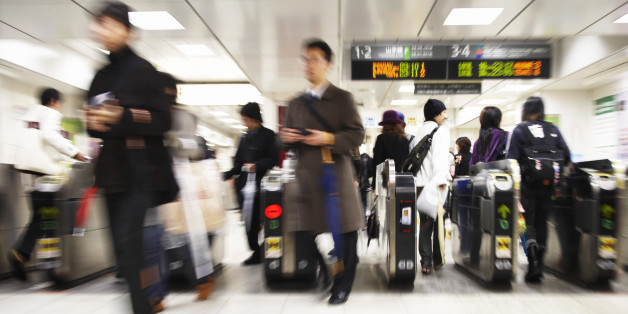 Commuters Walking Through Turnstiles, Japan