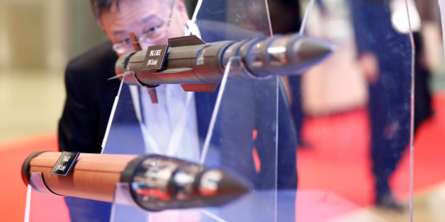 A man looks at models of Lockheed Martin's PAC-3, PAC-3 MSE and THAAD missiles during Japan Aerospace 2016 air show in Tokyo, Japan, October 12, 2016. REUTERS/Kim Kyung-Hoon/File Photo