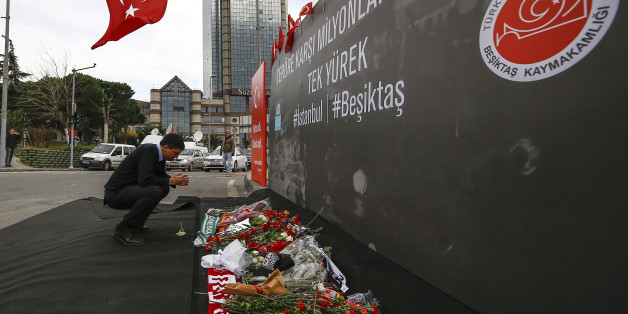 A man prays outside the Besiktas football club stadium Vodafone Arena in Istanbul, Monday, Dec. 12, 2016. Turkey launched a full investigation and bury the dead Monday after two bombings in Istanbul killed dozens of people and wounded score others near Besiktas' stadium. Turkish authorities have banned distribution of images relating to the Istanbul explosions within Turkey.(AP Photo/Emrah Gurel)