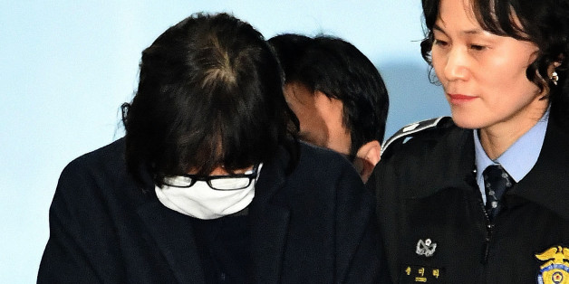 SEOUL, SOUTH KOREA - NOVEMBER 03: Choi Soon-Sil, a confidant of South Korean President Park Geun-Hye, is to get on a bus of Ministry of Justice as she leaves the Seoul Central District Court on November 3, 2016 in Seoul, South Korea. The prosecutors was issued an arrest warrant for Choi Soon-sil for allegedly influencing state affairs and embezzling money by taking advantage of her close relationship with President Park Geun-hye. (Photo by Korea Pool/Getty Images)