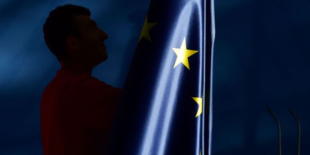 The flags, including the EU flag, are taken down after a press conference at the chancellery in Berlin, on June 27, 2016.
Britain's shock decision to leave the EU forces German Chancellor Angela Merkel into the spotlight to save the bloc, but true to her reputation for prudence, she said she would act neither hastily nor nastily. / AFP / John MACDOUGALL (Photo credit should read JOHN MACDOUGALL/AFP/Getty Images)