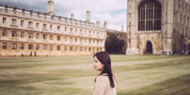 A young lady is walking in a campus