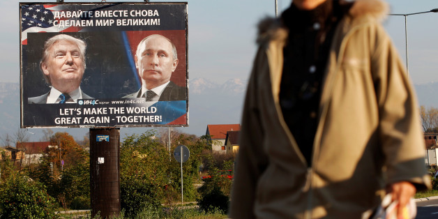A woman passes a billboard showing a pictures of US president-elect Donald Trump and Russian President Vladimir Putin in Danilovgrad, Montenegro, November 16, 2016. REUTERS/Stevo Vasiljevic