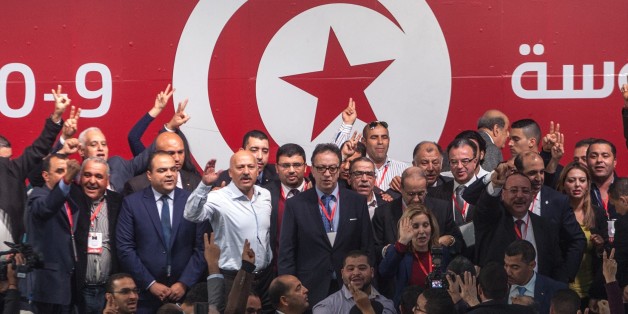 TUNIS, TUNISIA - JANUARY 10: Hafedh Caid Essebsi (C), new President of Tunisia's ruling Nidaa Tounes party and son of the Tunisian President Beji Essebsi, poses with the supporters during a media conference on January 10, 2016, in Tunis, Tunisia. (Photo by Amine Landoulsi/Anadolu Agency/Getty Images)