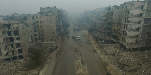 A still image from video taken December 13, 2016 of a general view of bomb damaged eastern Aleppo, Syria in the rain. Video released December 13, 2016. REUTERS/via ReutersTV