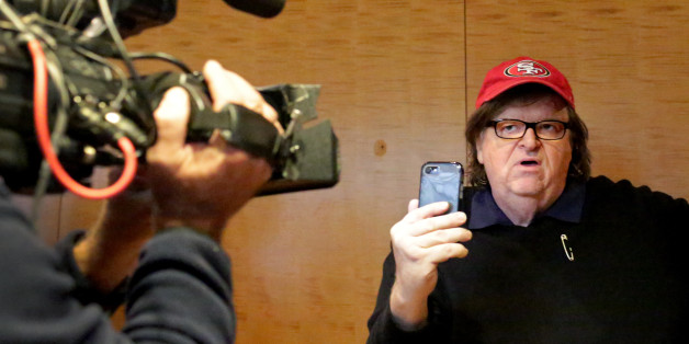 NEW YORK, NY - NOVEMBER 12: Filmmaker Michael Moore films himself with a smartphone at Trump Tower on November 12, 2016 in New York City. President-elect Donald Trump is holding meetings at his Trump Tower residence amid increased security in the area. (Photo by Yana Paskova/Getty Images)